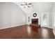 Bright living room features vaulted ceiling, brick fireplace and gleaming hardwood floors at 21 Enclave Walk, Powder Springs, GA 30127