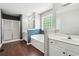 Bright main bathroom boasts a separate shower and a soaking tub with tile accents at 21 Enclave Walk, Powder Springs, GA 30127