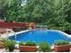 Above ground pool with an expansive deck perfect for relaxation and outdoor entertaining at 21 Enclave Walk, Powder Springs, GA 30127