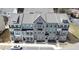 Aerial view of brick townhomes with unique color schemes and grey rooftops at 308 Overture Ct, Smyrna, GA 30080