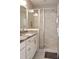 Modern bathroom features a glass-enclosed shower, sleek vanity, and elegant granite countertops at 308 Overture Ct, Smyrna, GA 30080