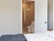Bedroom view into bathroom with sleek glass shower and modern fixtures, offering a private retreat at 308 Overture Ct, Smyrna, GA 30080