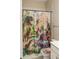 Whimsical bathroom with dinosaur-themed shower curtain and matching toilet seat cover, adding a playful touch at 308 Overture Ct, Smyrna, GA 30080