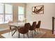 Open dining room showcasing a modern table with seating for six, with a decorative rug and artwork at 308 Overture Ct, Smyrna, GA 30080