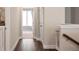 Bright hallway with wood flooring leads to a room with bright natural lighting at 308 Overture Ct, Smyrna, GA 30080
