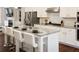 Spacious kitchen with granite counters, white cabinets, stainless steel appliances, and a large island at 308 Overture Ct, Smyrna, GA 30080