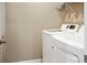 A clean, well-maintained laundry room with modern, white washer and dryer units at 308 Overture Ct, Smyrna, GA 30080