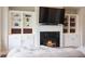 Cozy living room featuring a fireplace, built-in shelving, and comfortable seating at 308 Overture Ct, Smyrna, GA 30080