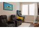 Entertaining theater room featuring cinema art, comfortable seating, and a vintage arcade game at 308 Overture Ct, Smyrna, GA 30080