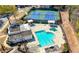 Stunning aerial view of community pool, tennis courts, and cabana offering endless outdoor recreation and leisure activities at 3285 Millwood Se Trl, Smyrna, GA 30080