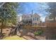Expansive backyard showcasing a multi-level deck, lush landscaping, and privacy fencing, perfect for outdoor enjoyment at 3285 Millwood Se Trl, Smyrna, GA 30080