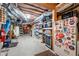 Unfinished basement space with ample storage, shelving, and a secondary refrigerator at 3285 Millwood Se Trl, Smyrna, GA 30080