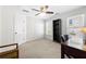 Bright bedroom featuring a desk, a ceiling fan and two closets at 3285 Millwood Se Trl, Smyrna, GA 30080