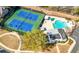 Aerial view of the community amenities featuring tennis courts and a refreshing swimming pool for residents' enjoyment at 3285 Millwood Se Trl, Smyrna, GA 30080