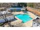 Refreshing community pool aerial view with plenty of space for lounge chairs and a covered picnic area at 3285 Millwood Se Trl, Smyrna, GA 30080