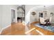 Open foyer leading to dining area with hardwood floors, soft lighting, and elegant staircase at 3285 Millwood Se Trl, Smyrna, GA 30080