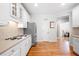 Modern kitchen with stainless steel refrigerator and oven, and hardwood floors at 3285 Millwood Se Trl, Smyrna, GA 30080