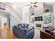 Bright living room with hardwood floors, tall ceilings, fireplace, and built-in shelving at 3285 Millwood Se Trl, Smyrna, GA 30080