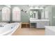 Bright and spacious main bathroom with double vanities and a soaking tub at 3285 Millwood Se Trl, Smyrna, GA 30080