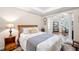 Inviting bedroom with neutral walls, a tray ceiling, and an ensuite office at 3285 Millwood Se Trl, Smyrna, GA 30080