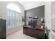 Bright office space with large window, vaulted ceiling, built-in shutters and neutral decor at 3285 Millwood Se Trl, Smyrna, GA 30080