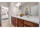 Bathroom features a double sink vanity with modern fixtures and a view into the bedroom at 11620 Crestview Ter, Johns Creek, GA 30024