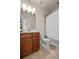 Cozy bathroom with a vanity, mirror, toilet, and shower with shower curtain at 11620 Crestview Ter, Johns Creek, GA 30024