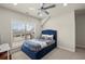 Cozy bedroom with an upholstered bed frame and bright natural light from large windows at 11620 Crestview Ter, Johns Creek, GA 30024
