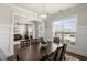 Bright dining room with views of the living room and featuring a modern lighting fixture at 11620 Crestview Ter, Johns Creek, GA 30024