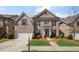 Beautiful two-story brick home with a manicured lawn and a two-car garage, perfect for a growing Gathering at 11620 Crestview Ter, Johns Creek, GA 30024