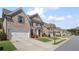 Inviting street view showcasing attractive homes with well-kept lawns and convenient two-car garages at 11620 Crestview Ter, Johns Creek, GA 30024