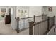 Elegant hallway features wood and iron railing and bright natural light from windows at 11620 Crestview Ter, Johns Creek, GA 30024