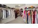 Large walk-in closet with lots of storage, shelving and plenty of hanging space at 11620 Crestview Ter, Johns Creek, GA 30024