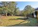 A spacious backyard with mature trees, providing ample space for recreation and outdoor activities at 1431 Brandy Shoals Se Ct, Conyers, GA 30013