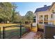 The backyard has a patio, a deck with stairs, and an air conditioning condenser at 1431 Brandy Shoals Se Ct, Conyers, GA 30013