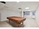 Basement rec room featuring a pool table area with tiled flooring, perfect for entertainment at 1431 Brandy Shoals Se Ct, Conyers, GA 30013