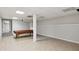 Basement rec room featuring a pool table area with tiled flooring and access to the upper floors at 1431 Brandy Shoals Se Ct, Conyers, GA 30013