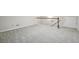 Spacious basement area with new carpeting and a stairway leading up to the next level at 1431 Brandy Shoals Se Ct, Conyers, GA 30013