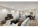 Finished basement with recreational area, seating, and modern decor at 1431 Brandy Shoals Se Ct, Conyers, GA 30013
