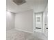 The basement features neutral carpet, white walls, drop ceilings and leads to a bathroom at 1431 Brandy Shoals Se Ct, Conyers, GA 30013