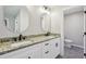 Bathroom featuring double sinks, granite countertops, white cabinetry, and modern fixtures at 1431 Brandy Shoals Se Ct, Conyers, GA 30013