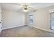 Bright bedroom with two windows, neutral walls and plush carpeting for comfort and style at 1431 Brandy Shoals Se Ct, Conyers, GA 30013