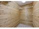 The closet features wood paneling, white shelving and neutral carpet at 1431 Brandy Shoals Se Ct, Conyers, GA 30013