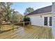 The wooden deck features a black railing, privacy fence, and access to the backyard at 1431 Brandy Shoals Se Ct, Conyers, GA 30013