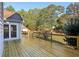 The wooden deck has black railings and provides access to the backyard at 1431 Brandy Shoals Se Ct, Conyers, GA 30013