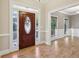 Foyer featuring an elegant front door with decorative glass and hardwood floors at 1431 Brandy Shoals Se Ct, Conyers, GA 30013