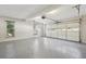 The garage features an epoxy floor, an automatic garage door, and natural light at 1431 Brandy Shoals Se Ct, Conyers, GA 30013