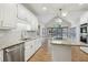 Gourmet kitchen with granite countertops, stainless steel appliances, island with cooktop, and double ovens at 1431 Brandy Shoals Se Ct, Conyers, GA 30013