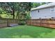 Fenced backyard featuring new artificial turf, perfect for children, pets and low maintenance at 1904 Woodland Hills Nw Ave, Atlanta, GA 30318