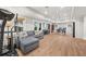 Spacious basement with laminate floors, living area, exercise equipment, and a dining table at 1904 Woodland Hills Nw Ave, Atlanta, GA 30318